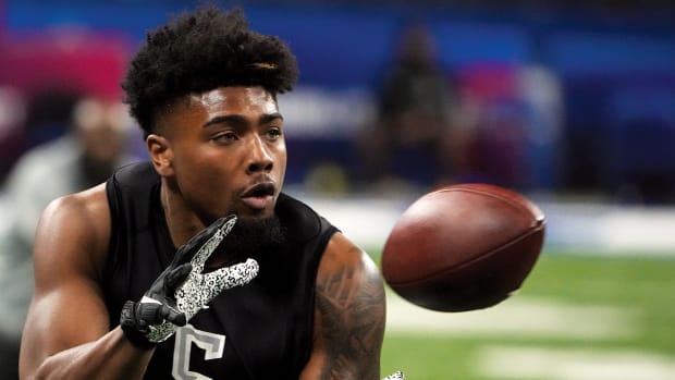p.p1 {margin: 0.0px 0.0px 0.0px 0.0px; font: 13.0px 'Helvetica Neue'}    rkansas wide receiver Treylon Burks (WO05) goes through drills during the 2022 NFL Scouting Combine at Lucas Oil Stadium.